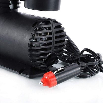 Black car pump with red and black connector on a white background