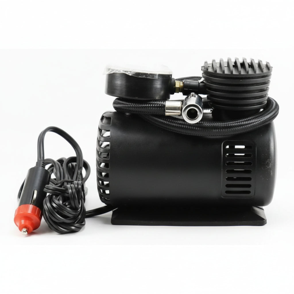 Car air compressor with gauge and cable on a white background